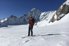 Dave Alderson ski touring Upper Fox Glacier NZ with South face of Douglas behind