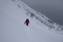 Kevin Wheeler making his way through deep snow to WI4 route stance